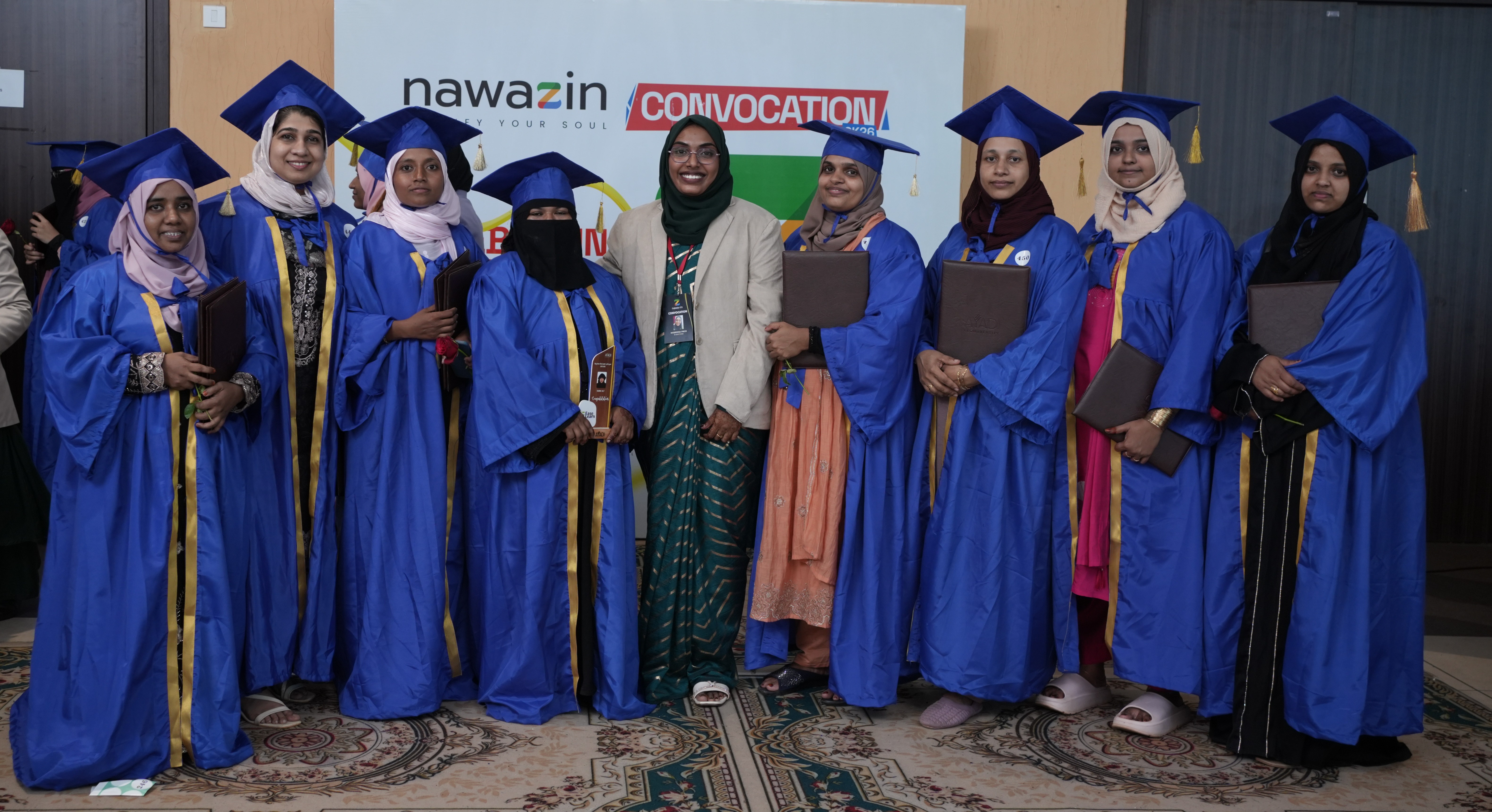 Graduates posing with mentor